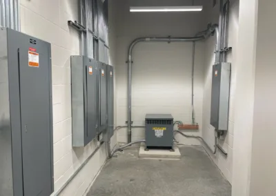 A room with a lot of electrical equipment in it.